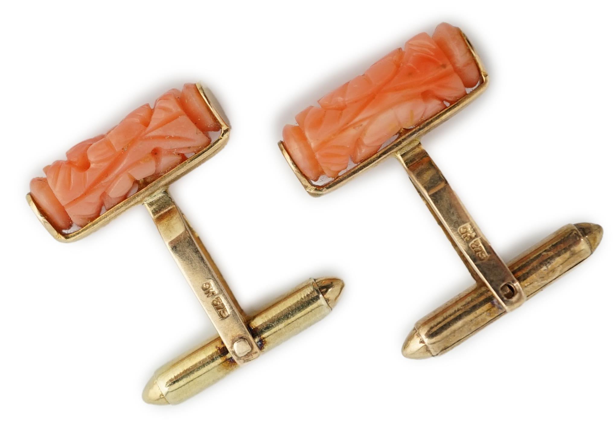 A pair of 9k gold and carved coral set cufflinks